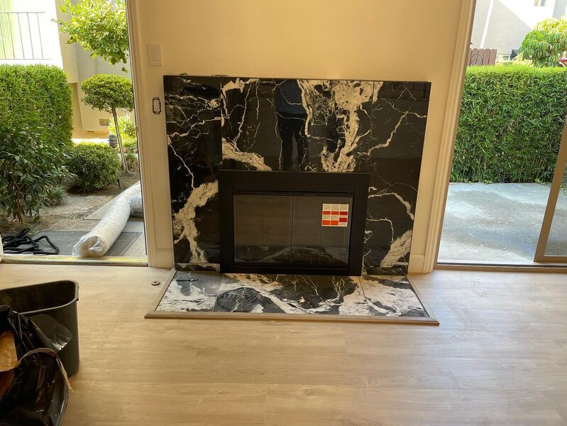 Fireplace surround in black and white marble